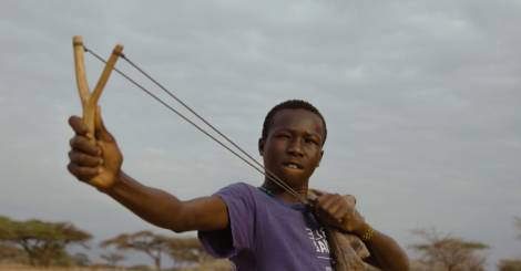 boy with slingshot